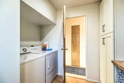 a laundry room with a washer and dryer at Bethel Island Sanctuary with Dock and Boathouse in Oakley