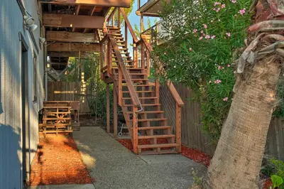 a wooden staircase leading up to a house at Bethel Island Sanctuary with Dock and Boathouse in Oakley