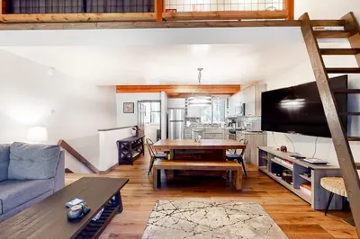 a living room with a couch and a table at Truckee Treat in Kingswood Estates