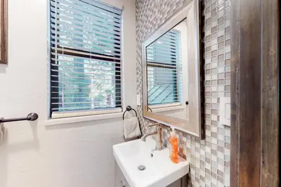 a bathroom with a sink and a mirror at Truckee Treat in Kingswood Estates