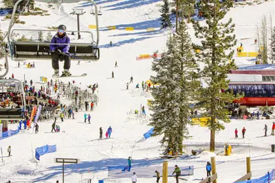 a group of people skiing on a ski slope at Truckee Treat in Kingswood Estates