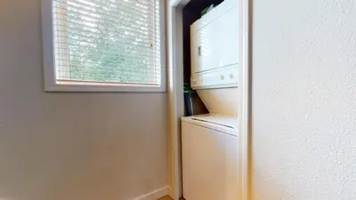 a refrigerator in a kitchen with a window at Mammoth Green #214 condo in Mammoth Lakes