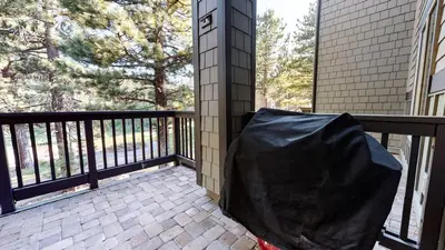 a screened in porch with a black tarp on it at Mammoth Green #111 condo in Mammoth Lakes