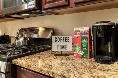 a kitchen counter with a sign that says coffee time at Dream Family Home in South Reno 4 bed 30 Min to Lake Tahoe in Steamboat