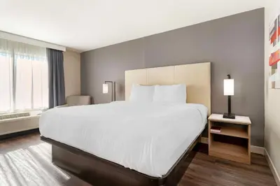 a large white bed in a hotel room at Best Western Plus Rancho Cordova Inn in Rancho Cordova