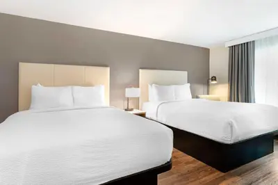 a hotel room with two beds and a window at Best Western Plus Rancho Cordova Inn in Rancho Cordova