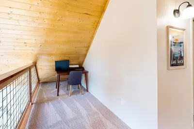 a staircase with a desk and a computer in a house at Truckee Secret in Truckee