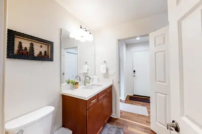 a bathroom with a sink and a toilet and a mirror at Truckee Secret in Truckee