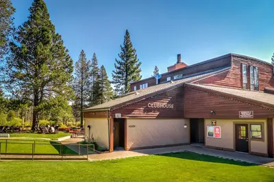 a house with a garage in a yard at Truckee Mountain Retreat in Truckee