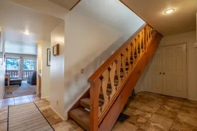 a hallway with a wooden staircase in a home at Rr-interlaken 19 in June Lake