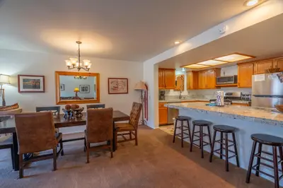 a kitchen and dining room with a table and chairs at Rr-interlaken 19 in June Lake