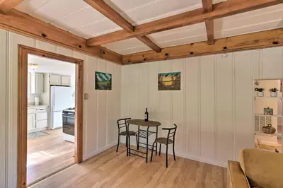 a kitchen and dining room with a table and chairs at Wine Country Escape with Hot Tub in River Pines! in River Pines