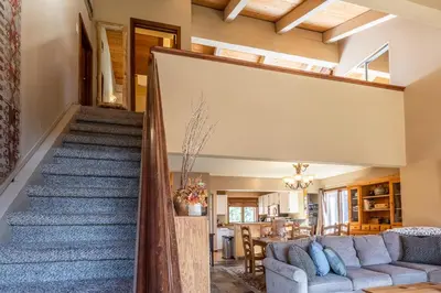 a living room and staircase in a house at Sunrise 9 in Mammoth Lakes