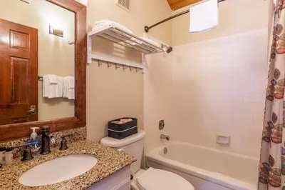 a bathroom with a sink and a toilet and a tub at Sunrise 9 in Mammoth Lakes