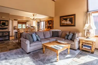 a living room with a couch and a table at Sunrise 9 in Mammoth Lakes