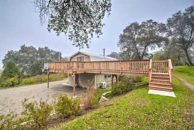 a house with a wooden bridge over a yard at Family Home Near Kings and Sequoia National Parks! in Squaw Valley