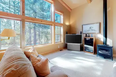 a living room with a couch and a tv at Tahoe Donner Escape in Truckee
