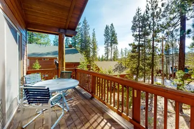 a porch with a table and chairs on a deck at Tahoe Donner Escape in Truckee