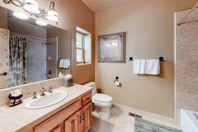 a bathroom with a sink and a toilet and a shower at Tahoe Donner Escape in Truckee