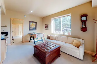 a living room with a couch and a table at Tahoe Donner Escape in Truckee