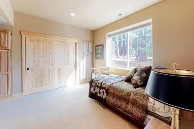 a living room with a couch and a window at Tahoe Donner Escape in Truckee
