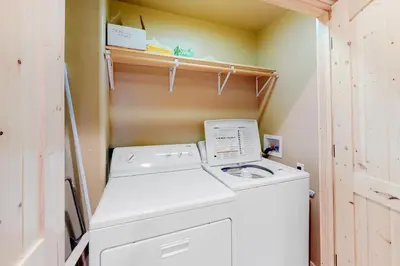 a washer and dryer in a small laundry room at Tahoe Donner Escape in Truckee
