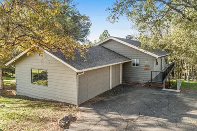 a house with a garage with a driveway at Wildflower Landing in Groveland