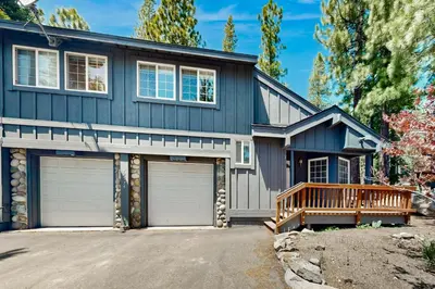a house with two garage doors and a porch at Little Pinecone Retreat in Truckee