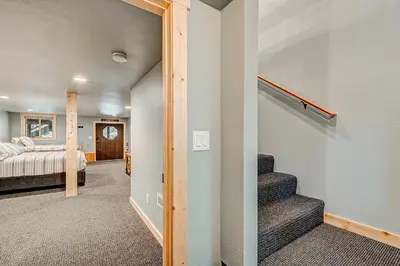 a room with a staircase leading to a bedroom at The Truckee Vibe in Soda Springs
