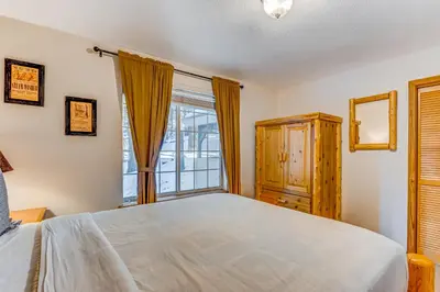 a bedroom with a large bed and a window at Mountainside Retreat in Truckee