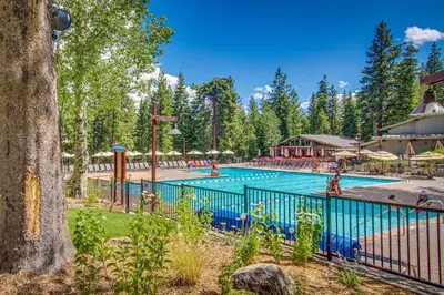 a pool at a resort with people in it at Mountainside Retreat in Truckee