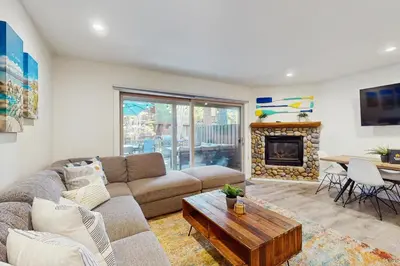 a living room with a couch and a fireplace at Peace Among the Pines in Incline Village