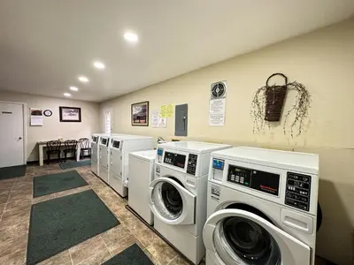 a laundry room with three washing machines in it at La Vista Blanc #44 condo in Mammoth Lakes