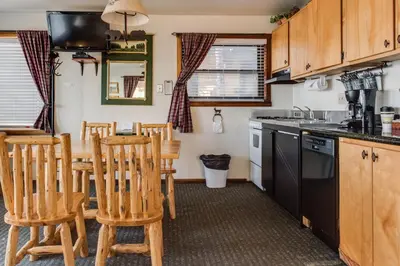 a kitchen with a table and chairs in a kitchen at Franciscan Lodge in Tahoe Vista