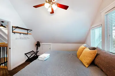a bedroom with a bed and a ceiling fan at Starfall in Yosemite West