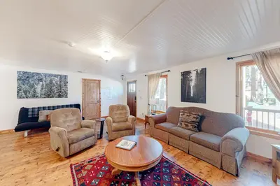 a living room with a couch and chairs and a table at Oso Lodge Unit B in Yosemite West