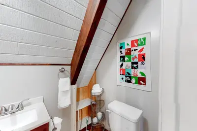 a bathroom with a toilet and a sink at Cozy Cabin Retreat in South Lake Tahoe