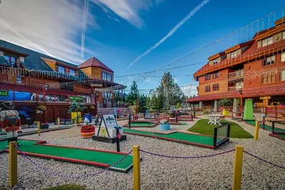 a playground in a courtyard in a building at Cozy Cabin Retreat in South Lake Tahoe