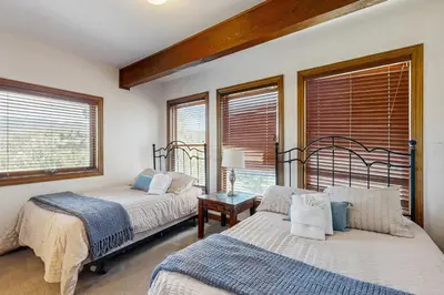 a bedroom with two beds and a window at Lookout Lodge in Zephyr Cove