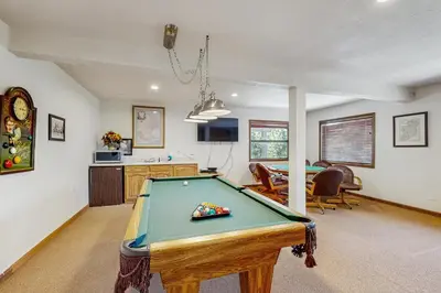 a pool table in the middle of a living room at Lookout Lodge in Zephyr Cove