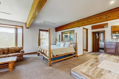 a bedroom with a bed and a couch at Lookout Lodge in Zephyr Cove