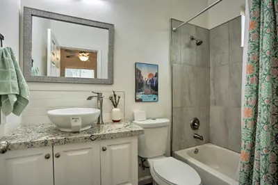 a bathroom with a sink and a toilet and a shower at Stunning Clovis Home about 1 Mile to Old Town! in Clovis