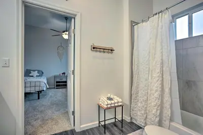 a bathroom with a shower and a bedroom with a bed at Stunning Clovis Home about 1 Mile to Old Town! in Clovis
