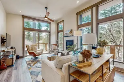 a living room with a couch and a table at Bear's Den in Truckee