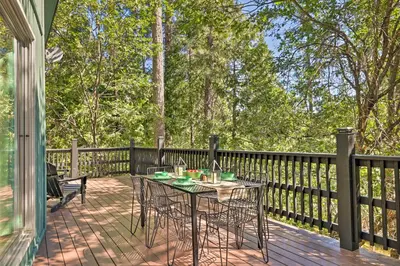 a patio with a table and chairs on a deck at Near Trails Cabin with 2-Level Deck in Twain Harte in Twain Harte