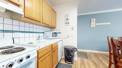 a kitchen with a sink and a stove top oven at Krystal Villas East #312 condo in Mammoth Lakes