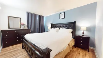 a bedroom with a large bed and a mirror at Krystal Villas East #312 condo in Mammoth Lakes