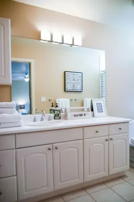 a bathroom with a sink and a large mirror at Sierra Ranch - A Yosemite Retreat in Mariposa