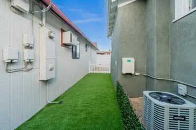 an alley between a building with an air conditioner at Plush 2-bed apt in Riverside Heights! in Reno