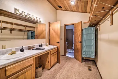 a bathroom with a sink and a mirror at Deck and Fireplace Log Cabin in Tahoe Donner! in Truckee